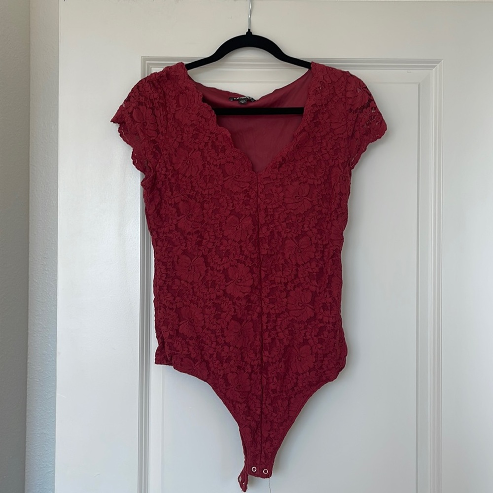 Express red bodysuit. Floral pattern. Size medium.